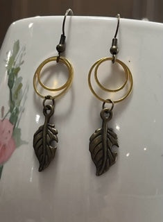 Gold small hoops with leaf dangle
