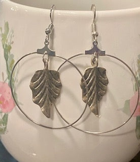 Large silver hoop with leaf dangle